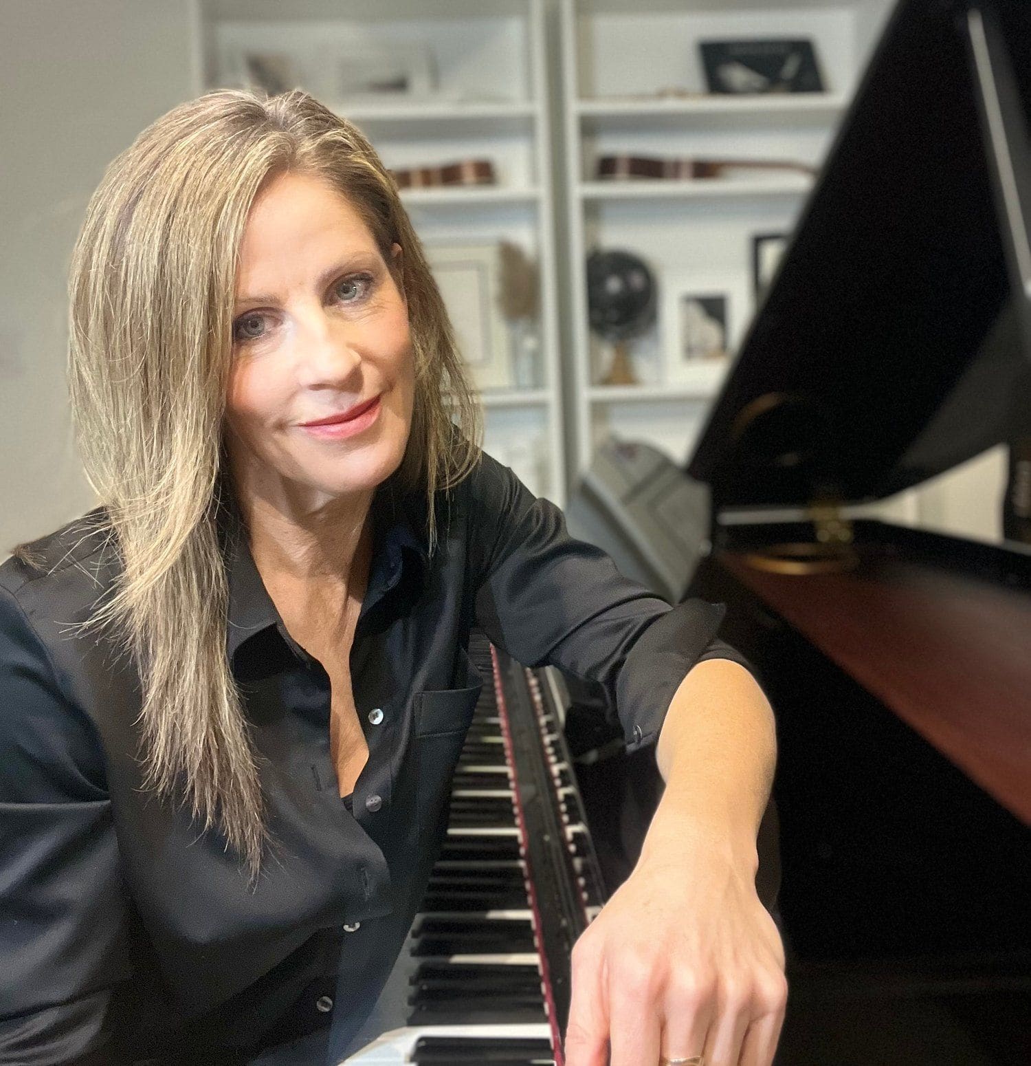 Rachelle Risling at the piano in her Burlington studio
